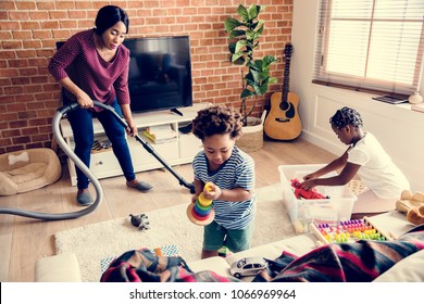 Black Family Cleaning The House Together
