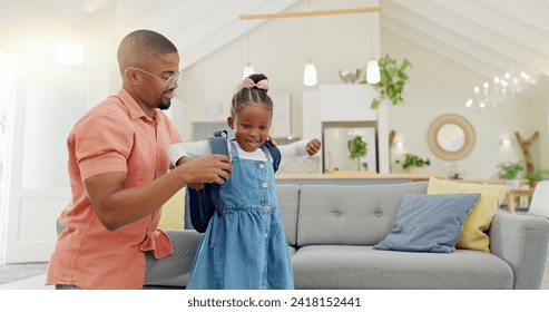 Black family, education and girl with backpack for school, kindergarten and high five from dad for support and motivation. Child, student and father helping to get ready and leave house in morning - Powered by Shutterstock