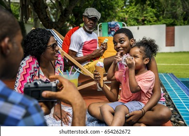 Black Family Enjoying Summer Together At Backyard