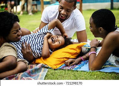 Black Family Enjoying Summer Together At Backyard