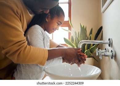 Black family, father and child washing hands with clean water in home bathroom. Man teaching girl while cleaning body part for safety, healthcare and bacteria for learning about health and wellness - Powered by Shutterstock