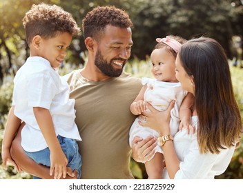 Black Family, Happy And Nature Park With People Holding A Child And Baby Outdoor. Mother, Father And Children Together In The Summer Sun With Happiness Smile And Kids Spending Quality Time Outdoors