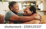 Black family, happy and women on sofa for hug, love and support in living room. Elderly mother, daughter and embrace at home for care, surprise visit and reunion on couch with excitement and trust