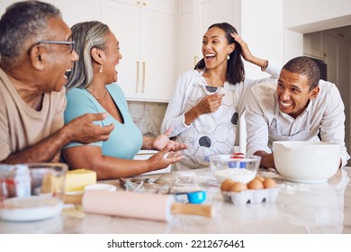 Black Family, Kitchen And Happy For Cooking, Baking And Bonding In Home. Family, Comic And Conversation For Happiness, Love And Time Together On Holiday, Vacation Or Break To Relax, Talking And Fun