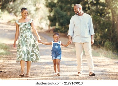 Black Family, Love And Active Parents Walking With Their Child Through Nature For An Adventure And Outdoor Fun. Happy African Man And Woman With Daughter Enjoying Travel, Vacation And Leisure Walk