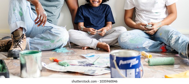 Black Family Painting House Wall