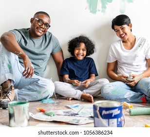 Black Family Painting House Wall