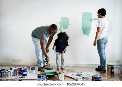 Black Family Painting House Wall