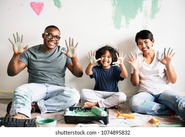 Black Family Painting House Wall