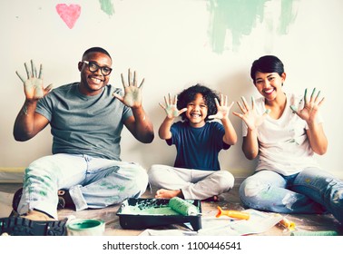 Black Family Painting The House Wall