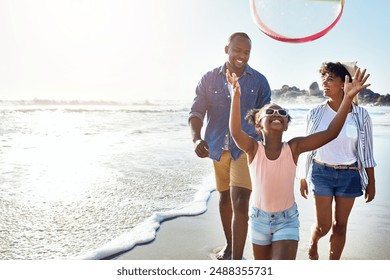 Black family, parents and daughter with ball on beach for holiday, vacation and outdoor fun in USA. Child with father, mother or happy people for games, adventure and playing or bonding by ocean - Powered by Shutterstock