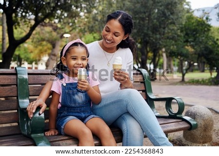 Black family, park and ice cream with a mother and daughter bonding together while sitting on a bench outdoor in nature. Summer, children and garden with a woman and girl enjoying a sweet snack