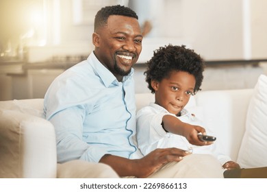 Black family, sofa and father with boy with remote for tv channel, streaming movies and watching film. Love, home and happy dad with child with television control for entertainment, cartoon and relax