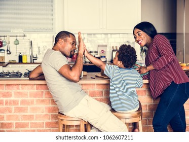 Black family spending time together - Powered by Shutterstock