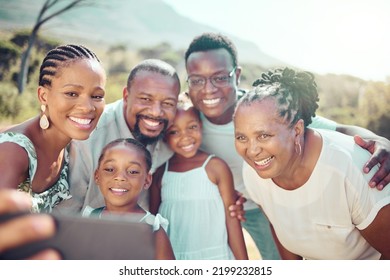 Black Family Taking A Selfie With Happy Children In Nature Together In Fun Natural Outdoors In Summer. Freedom, Smile And Senior Woman With African Kids Smiling For Phone Camera On A Holiday Vacation