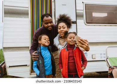 Black Family Taking Selfie Photo During Journey On Trailer Outdoors