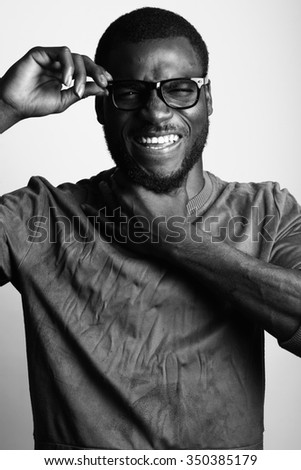 Similar – Image, Stock Photo African student with a bald head wearing a white shirt