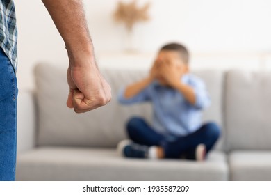 Black Father Clenching Fist Ready To Hit Scared Son Indoor