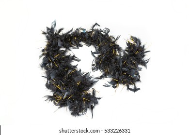 Black feather boa with gold tinsel isolated on white background - Shutterstock ID 533226331