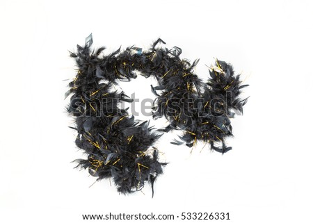 Black feather boa with gold tinsel isolated on white background