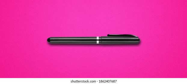 Black felt pen isolated on pink banner background