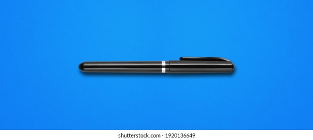 Black felt pen isolated on blue banner background