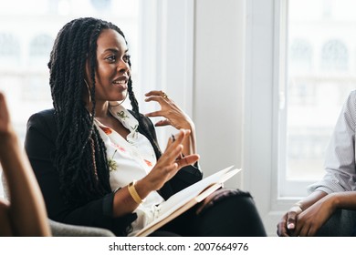 Black Female Boss Talking At A Meeting