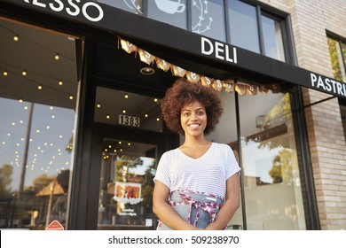 Black Female Business Owner Standing Outside Cafe Shopfront