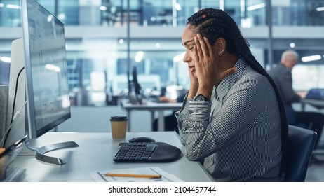 Black Female Corporate Office Worker Feels Stress, Sick, Frustration, Sick Works On Computer. Accountant Feeling Project Pressure, Has Headache Massages Her Head, Works With Statistics, Has Bad Day