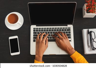 Black Female Hands Typing On Laptop. Top View Of African-american Woman Working At Office Desktop With Smartphone And Comuter. Education, Business And Technology Concept, Copy Space