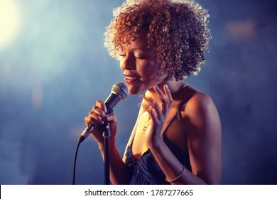 Black female Singer Performing on stage