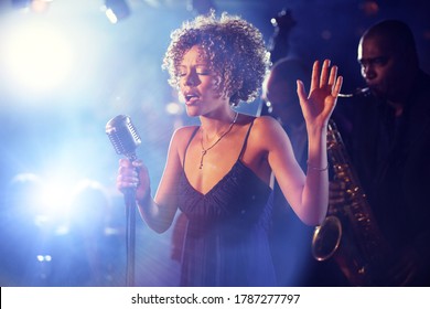 Black female Singer Performing on stage - Powered by Shutterstock