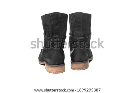 Black female winter boots isolated on white background.