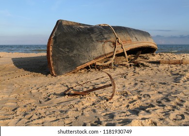 Image result for A boat parked in the sand upside down