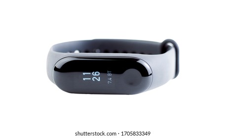 Black Fitness Bracelet Isolated On A White Background. Concept Of Modern Gadgets For Sports And Healthcare. Pedometer A Device For The Comprehensive Measurement Of Human Health While Walking.