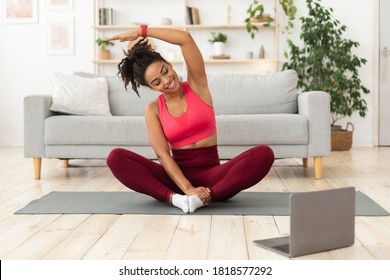 Black Fitness Woman Exercising At Laptop Having Online Training At Home. Stay Fit Concept