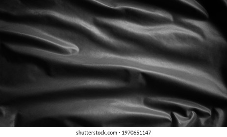 Black Flag Waving With Wind. Close Up Of Dark Banner Blowing, Soft And Smooth Silk. Fabric Texture Ensign Background