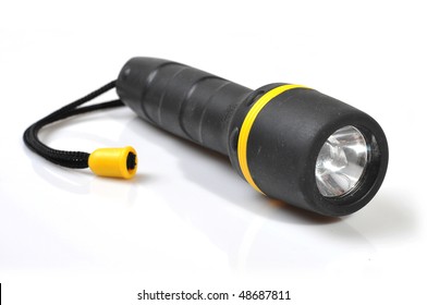 Black flashlight isolated on white background