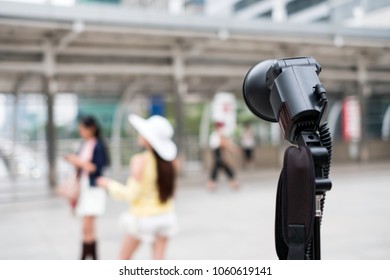 Black flashlight photographic with blurred young woman model poses in the city - Shutterstock ID 1060619141