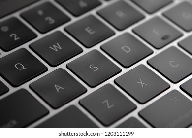 Black flat laptop keyboard close up