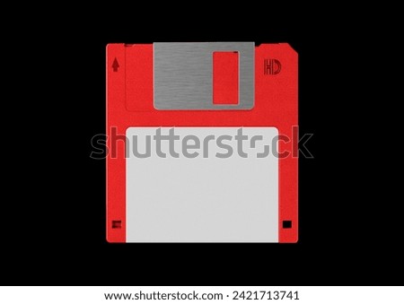 Black floppy disk or diskette isolated on black background