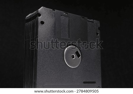 Black floppy diskettes. Floppy disk, diskette, or floppy diskette - type of disk storage made from a thin, flexible disk coated with magnetic storage medium