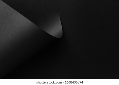 Black Folded Abstract Paper Minimalist Style Background. Fashion Trending Backdrop.