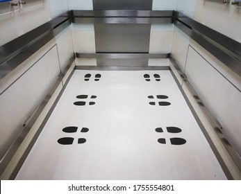 Black Footprint Sticker On The Elevator Or Lift Floor With Direction Of Standing Position To Limit Or Control Number Of People Entry Into The Lift ,Social Distancing In COVID-19,focus On The Footprint