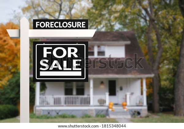 Black Foreclosure Home For Sale Real\
Estate Sign in front of an quaint countryside\
home.