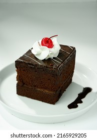 Black Forest Tart Chocolate Bread Wrapped In Chocolate Cream Is Usually Served For Birthdays, Valentines Or Other Party Events, Decorated With Cherries, Strawberries. Selective Focus