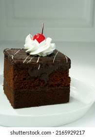 Black Forest Tart Chocolate Bread Wrapped In Chocolate Cream Is Usually Served For Birthdays, Valentines Or Other Party Events, Decorated With Cherries, Strawberries. Selective Focus