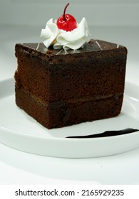 Black Forest Tart Chocolate Bread Wrapped In Chocolate Cream Is Usually Served For Birthdays, Valentines Or Other Party Events, Decorated With Cherries, Strawberries. Selective Focus