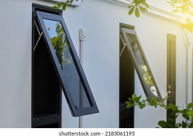 Black frame aluminium windows of building.