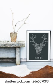 Black Frame DREAM BIG. Hipster Scandinavian Style Room Interior. Flower Pot With Weathered Branches And A Cow Rug On The Floor